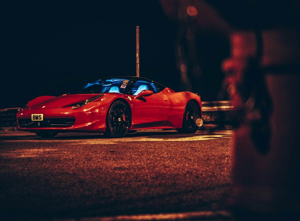 red ferrari sports car night